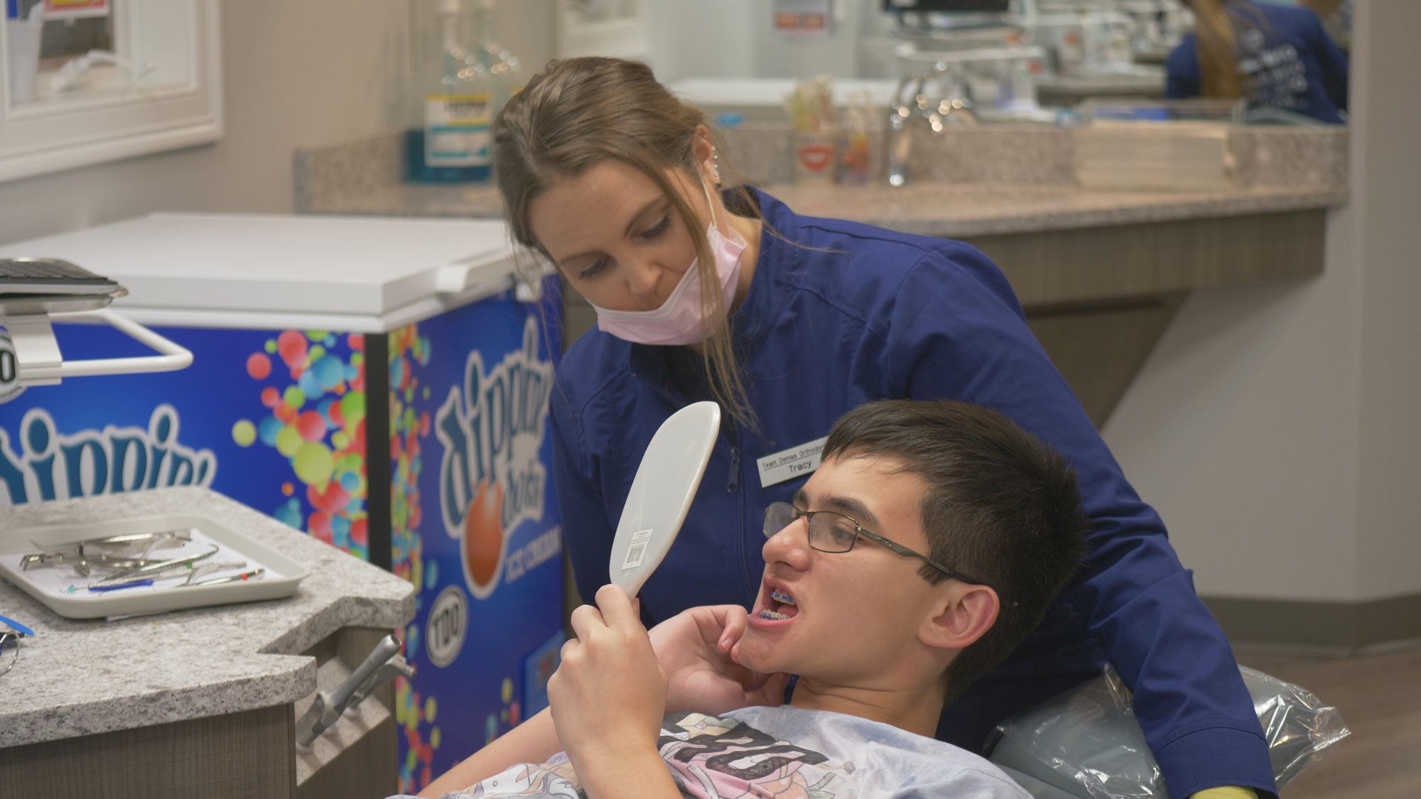 Demas staff working with a patient