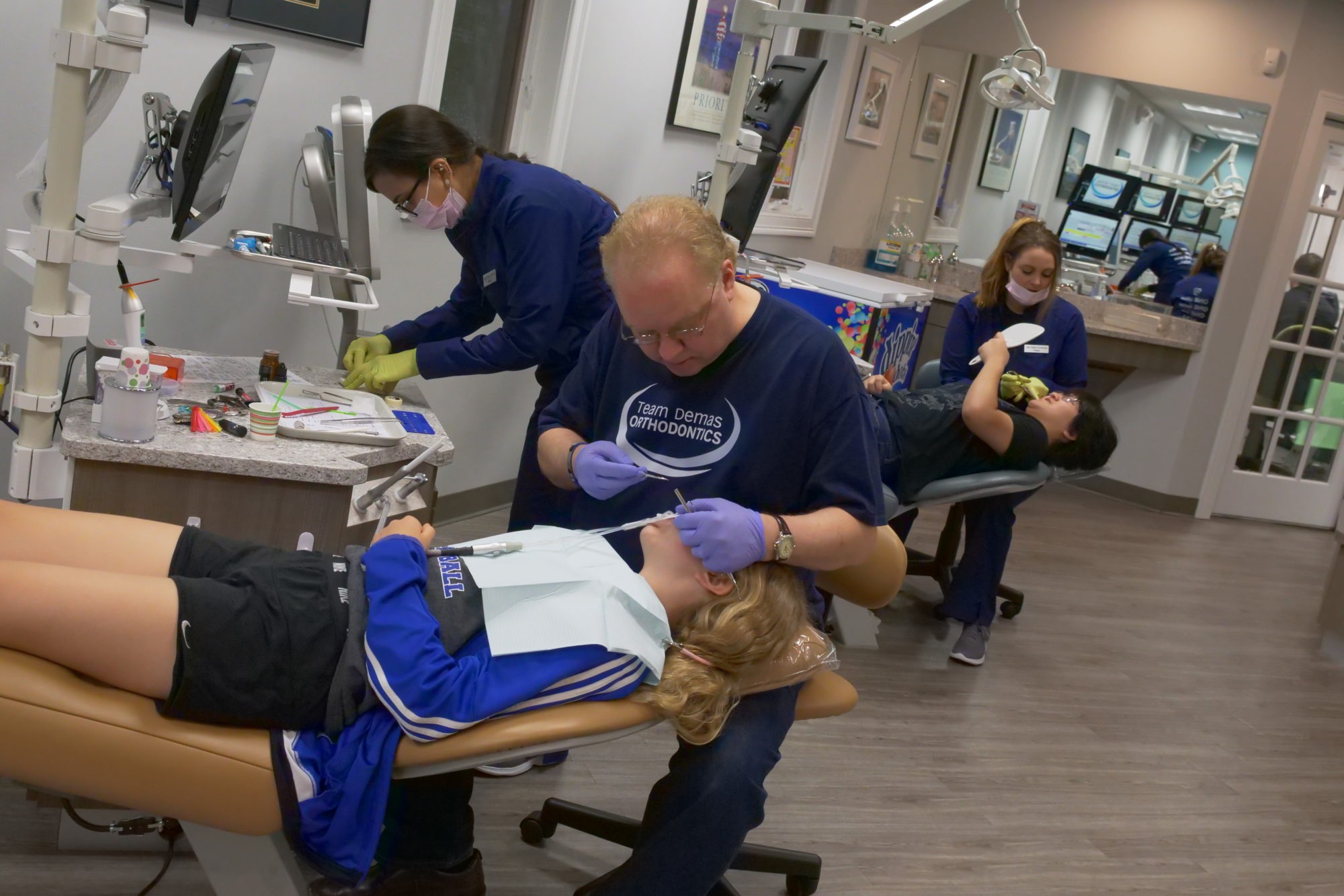 Dr. Demas working with a patient