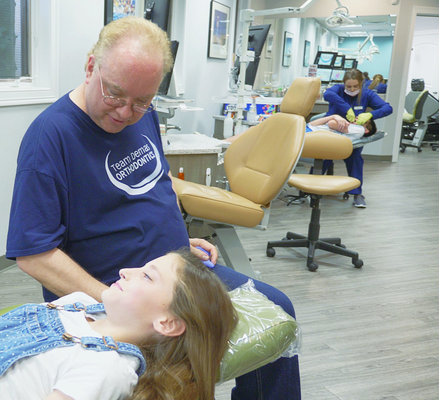 dr. demas and teen patient during visit