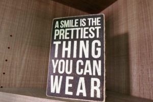 a smile is the prettiest thing you can wear