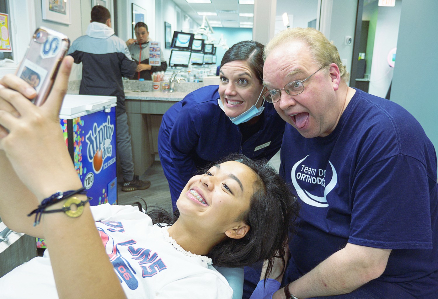 doctor demas taking selfie with young patient